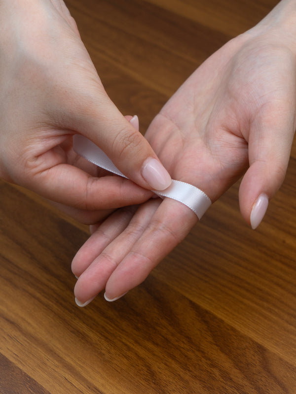 Step 1: Wrap a strip around the base of your finger