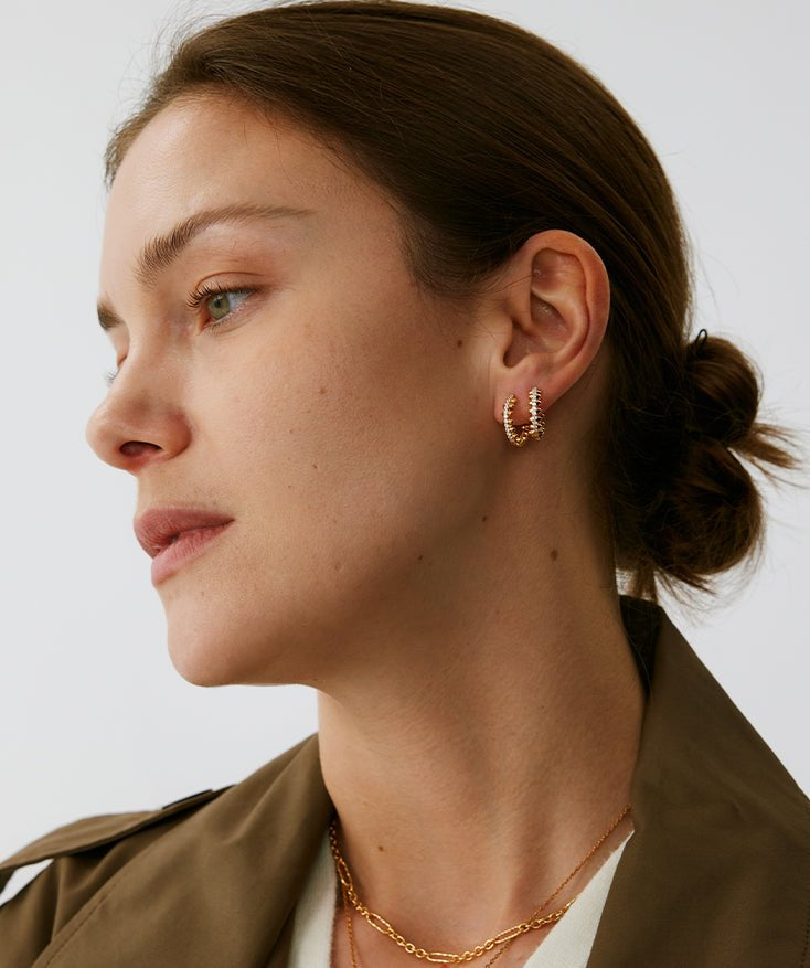 Gold Spiked Huggie Earrings | Belvria